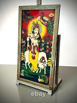 PEINTURE VINTAGE INDIENNE SUR VERRE RÉVERSIBLE KRISHNA VACHE SACRÉE SCÈNE PASTORALE 20e siècle