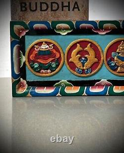 Relique sacrée du Tibet et du Népal : Frise en bois des huit symboles auspicieux bouddhistes d'époque.