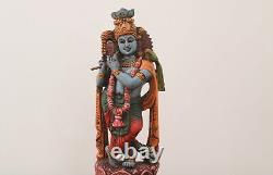 Statue antique en bois de Krishna : sculpture hindoue vintage pour la décoration de temple à domicile et de jardin.